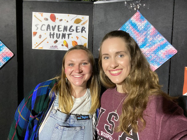 two women pose for a selfie.