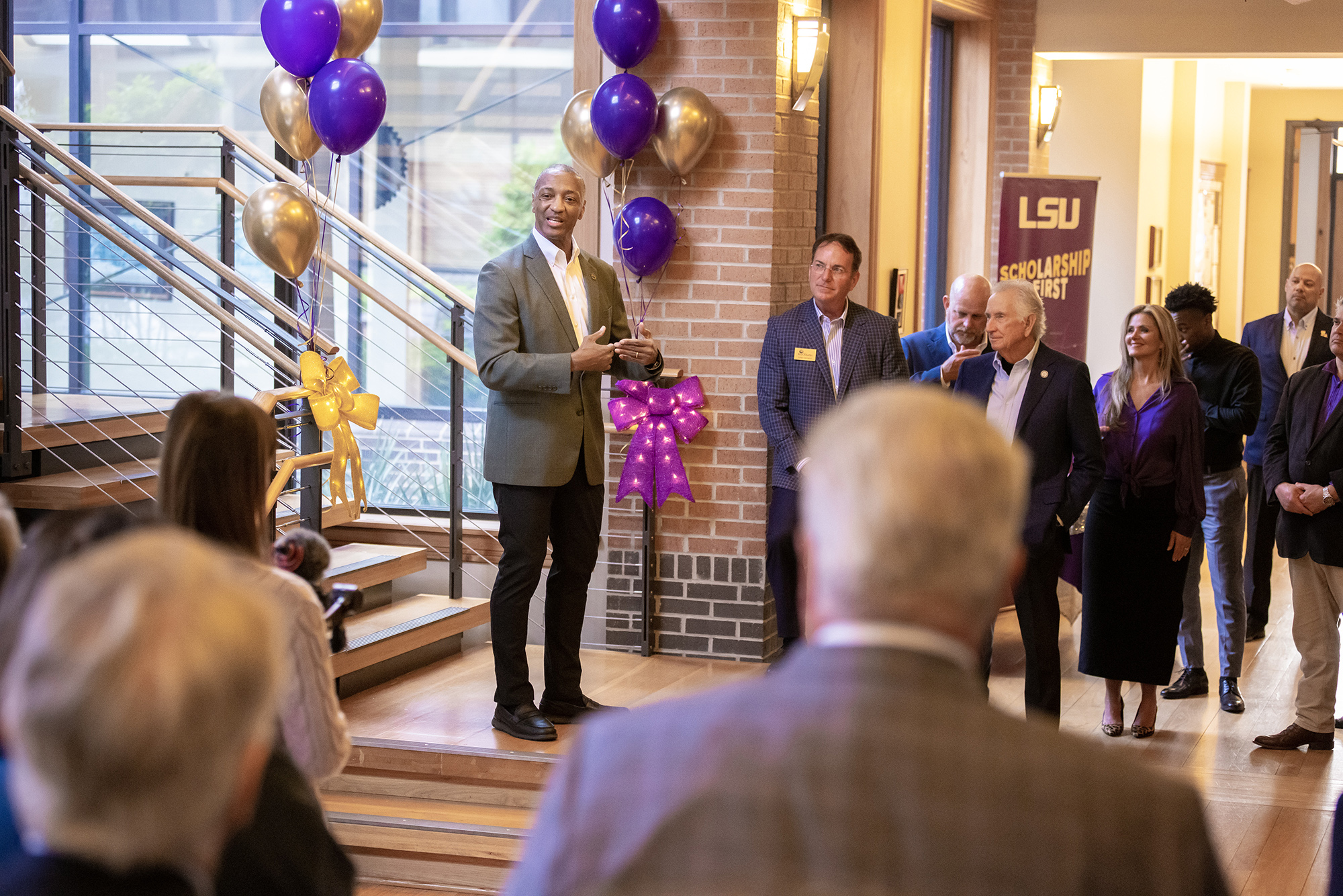 President Tate speaks to crowd from staircase