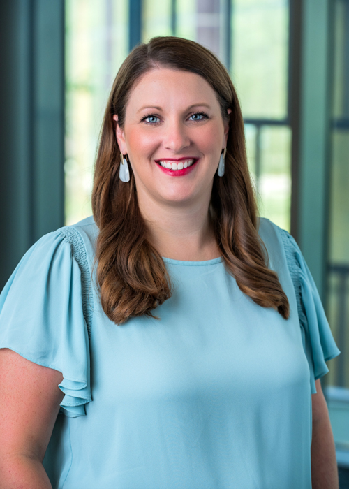 Julianna Richard headshot on a dark grey background