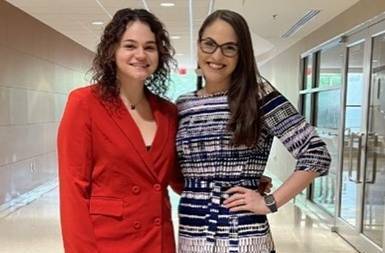 Kris Lindsey Hall stands proudly with her research mentee at LSU Discover Day in 2022.