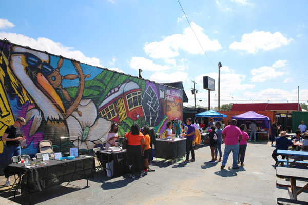 Vendors sell products at outdoor market.