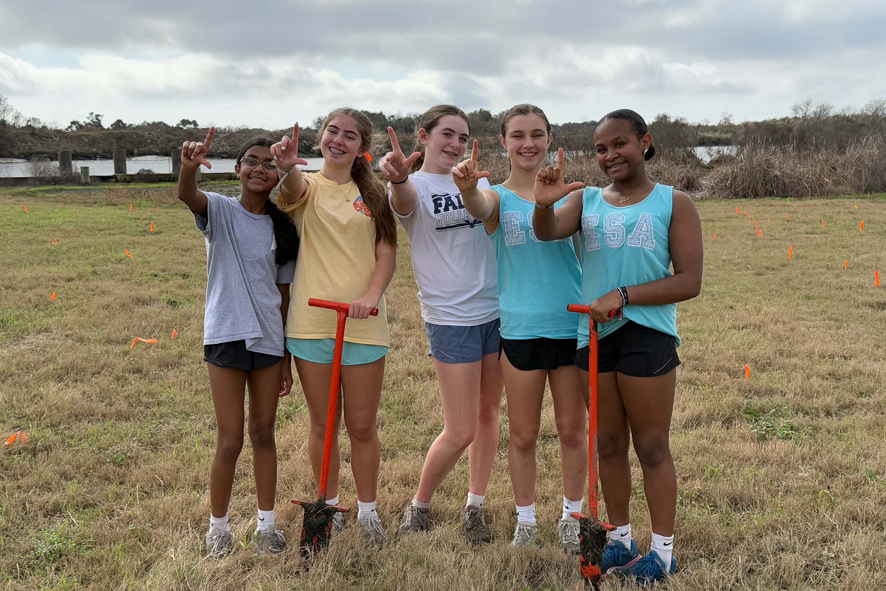 students at coastal roots planting