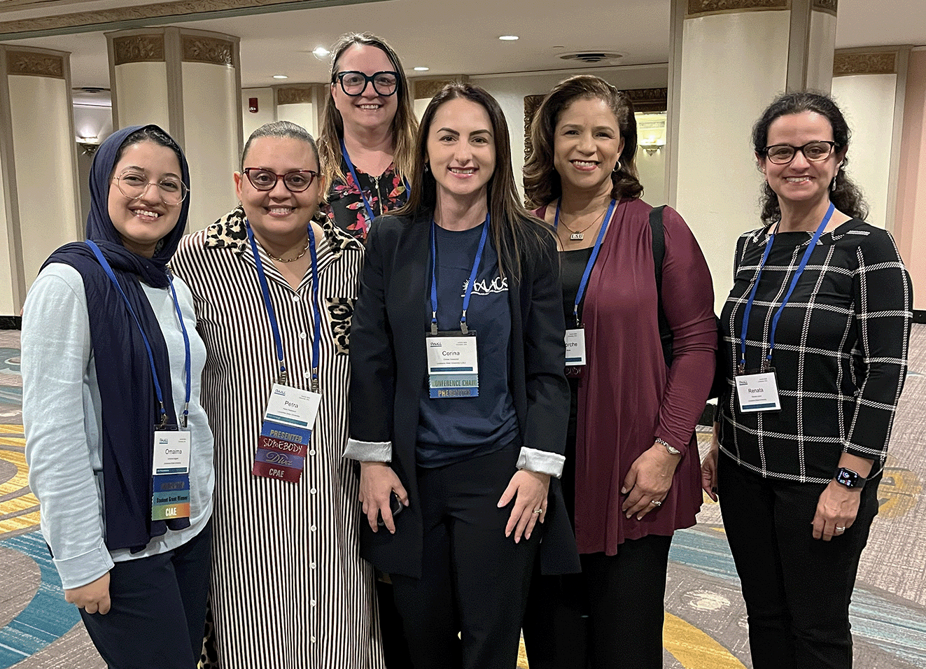 Faculty members Dr. Corina Caraccioli, Dr. Bethany Hager, Dr. Petra A. Robinson, and Dr. Renata Lyons, along with doctoral candidates Omaima Hajjami and Terri Ricks