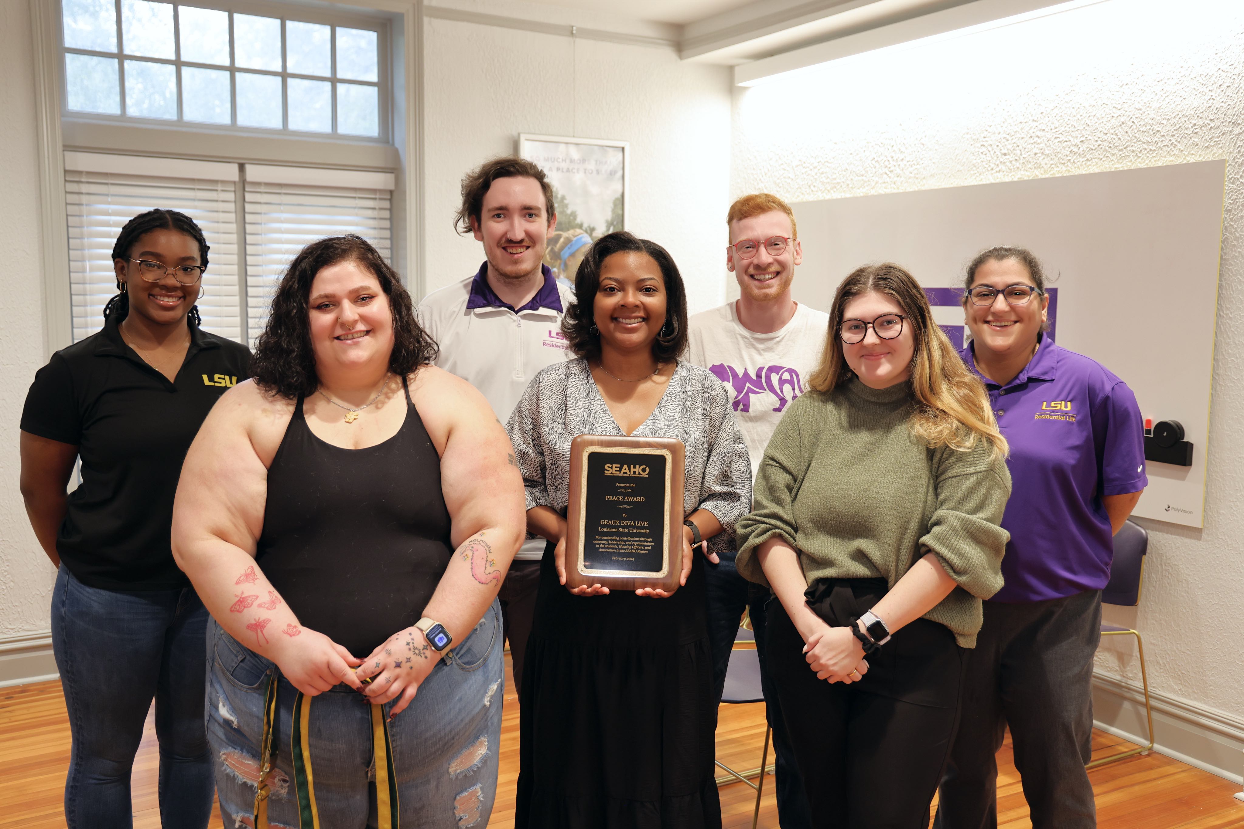 Geaux Diva Live! Implementation Team Poses with SEAHO Award