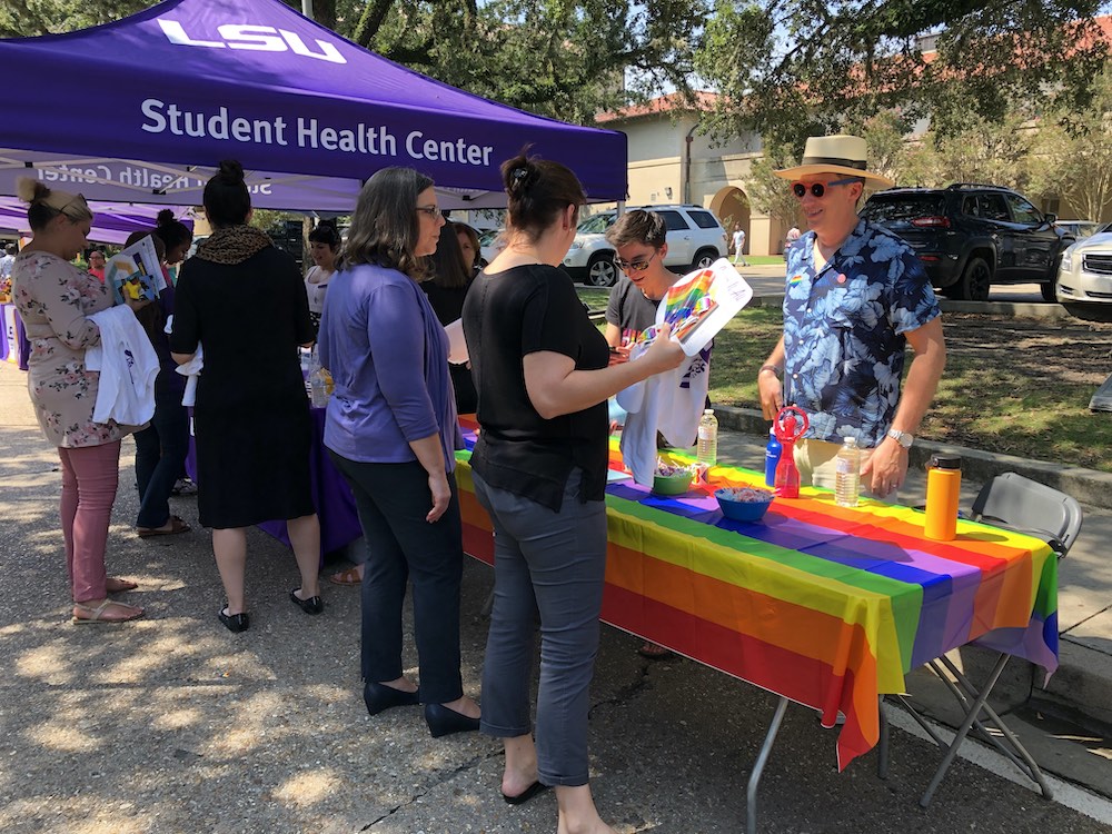 Caucus members talk to students at the Rainbeaux Rush